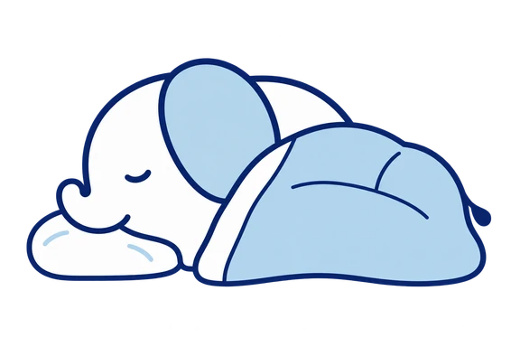 まくらに頭をのせ、布団で眠るねむぞーさん。